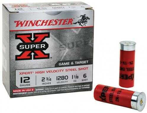 A box of Winchester 20 Gauge Three Quarter Oz Steel Number Seven shotgun shells, with two shells placed beside the box.