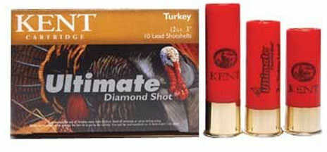 A box of Kent Cartridges 20 Gauge Turkey Shotshells 3 Inch Quarter Oz Size Five sits beside three red shotshells with gold bases, designed for turkey hunting.