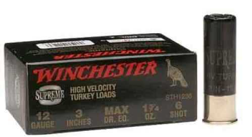 A black box of Winchester 12 Gauge Turkey Loads sits beside a single black shotgun shell with brass base. Box details show 1 3/4 oz, 5 shot, and Winchester branding.