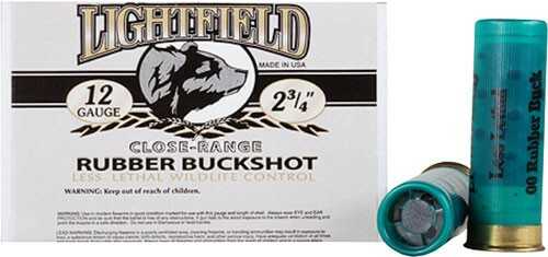 A box of Lightfield Ammo 12 Gauge 5 Rounds 2 3/4 Rubber #Ball sits with two teal non-lethal shells beside it. The box shows a wolf illustration and safety warnings.
