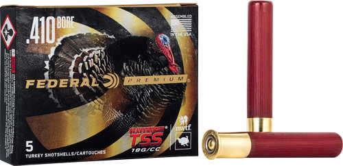 A box of Federal Heavyweight TSS Turkey 410 3 13/16 oz #7 shot shells sits beside two red and brass shells. The box, featuring a turkey image and product details, contains five high-performance Federal rounds.
